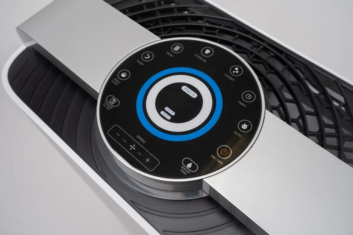 AIRE air purifier control panel showing real-time PM2.5, sterilise, ioniser and auto modes